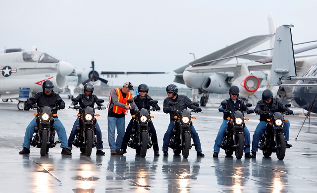 The scene from on the flight deck of the USS Yorktown while six veterans and active-duty military ride the H-D Street 500 as Harley-Davidson with the H-D Street 500 as Harley-Davidson announced it is offering current and former U.S. military free Riding Academy motorcycle training in Mt. Pleasant, S.C., Wednesday, May 6, 2105. (Mic Smith/AP Images for Harley-Davidson)