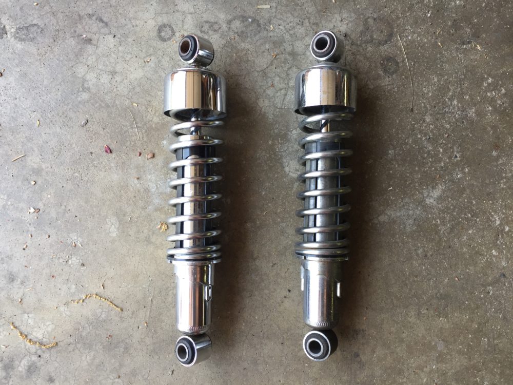 While they were off, I cleaned and polished the shocks. Clean on the left; grimy on the right.
