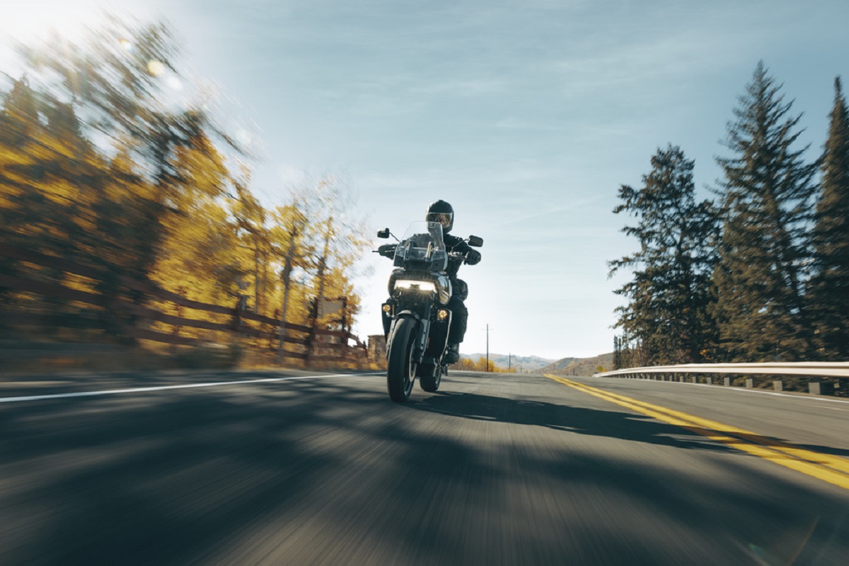 A black Harley-Davidson Pan America hits the road.